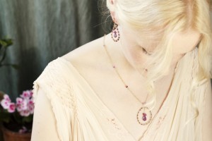 Model wears amethyst earrings and necklace